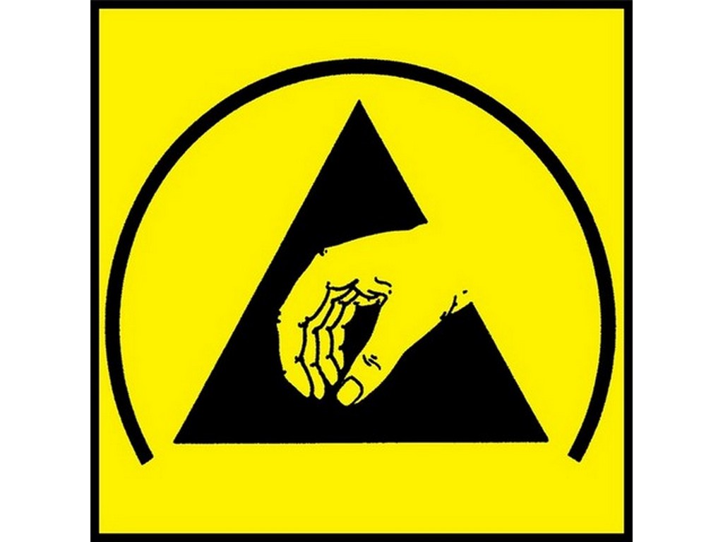 ESD symbol på gul bund med sort trekant og hånd.